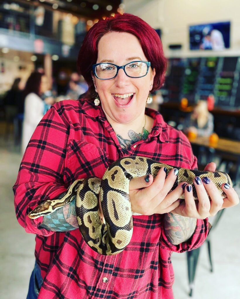 Author holding a snake, happily